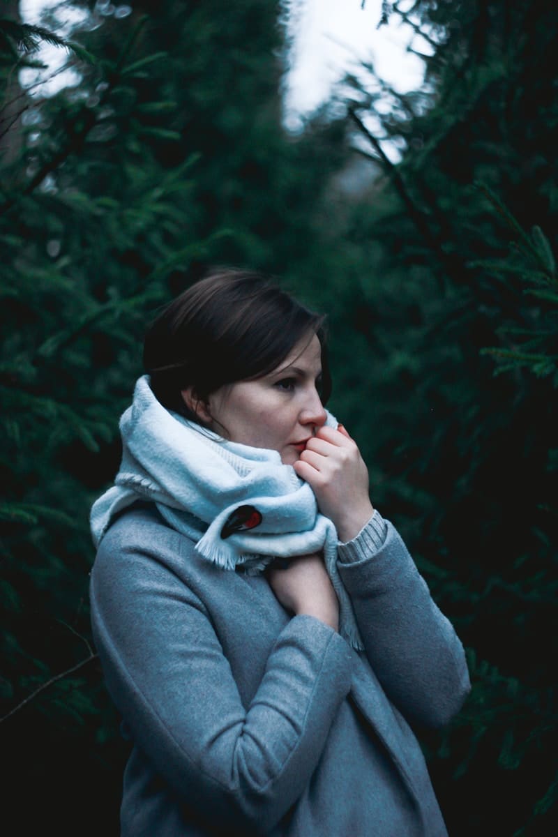 woman in gray sweater facing sideways