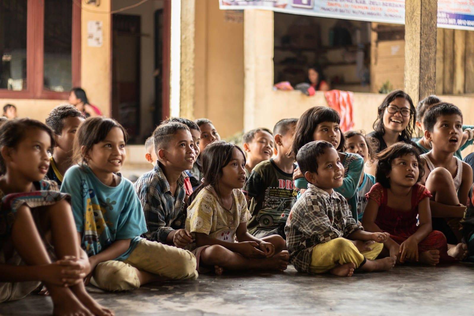 Photo by Yannis H group of childrens sitting on ground