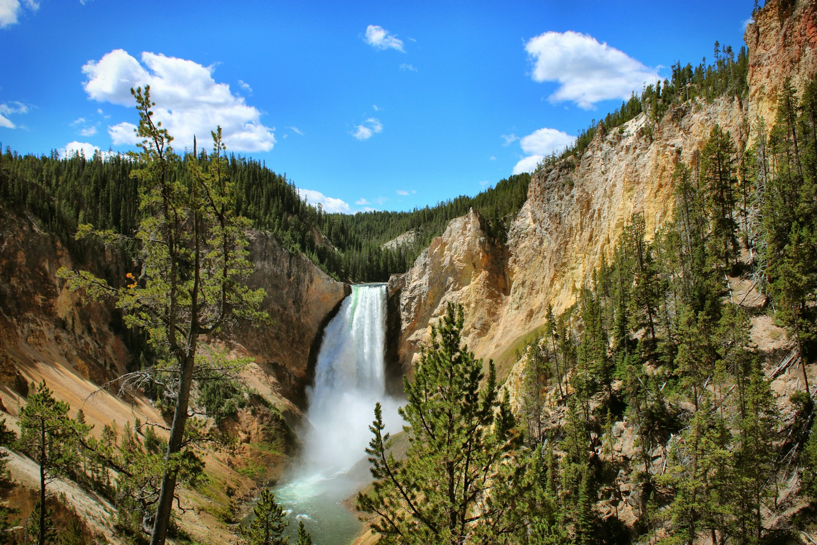 Photo by Laura Seaman waterfalls under blue sky during daytime