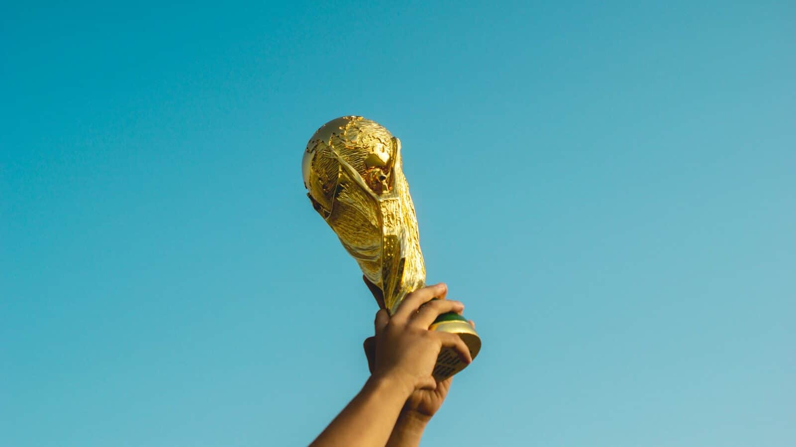 Photo by Fauzan Saari person holding gold trophy